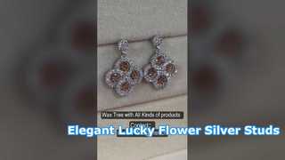 Elegantes brincos de prata CZ com flor da sorte 925