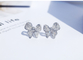 A platina Diamond Bow Stud Earrings 0.10ct CONTRA a claridade 4.5gram personalizou